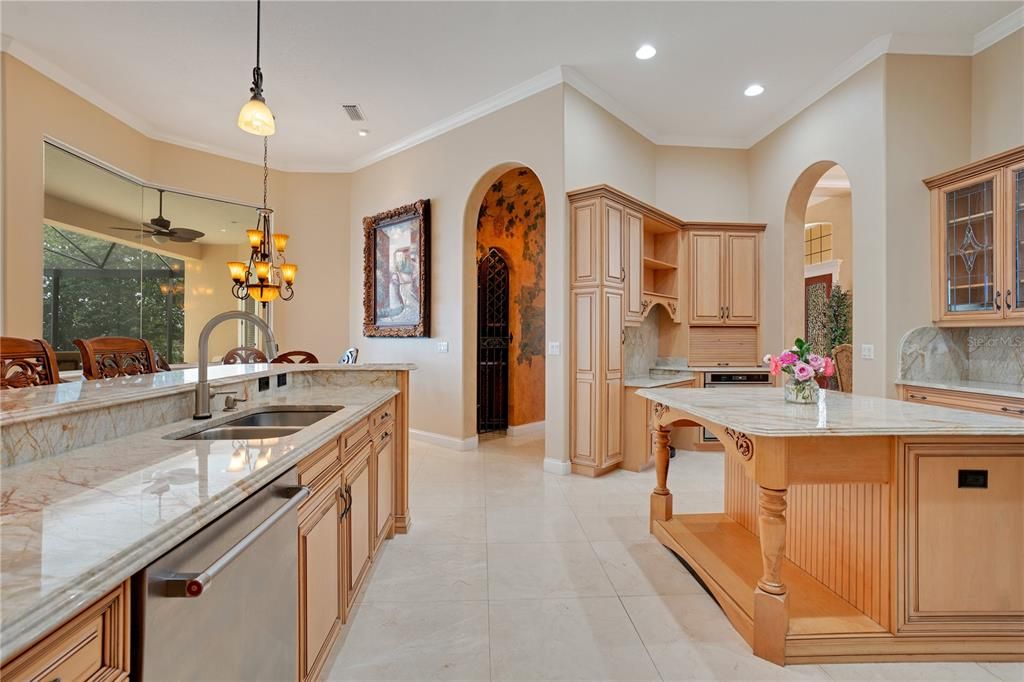 Kitchen has custom wood cabinetry, with beautiful Quartzite countertops & Kitchen Aid commercial style appliances.