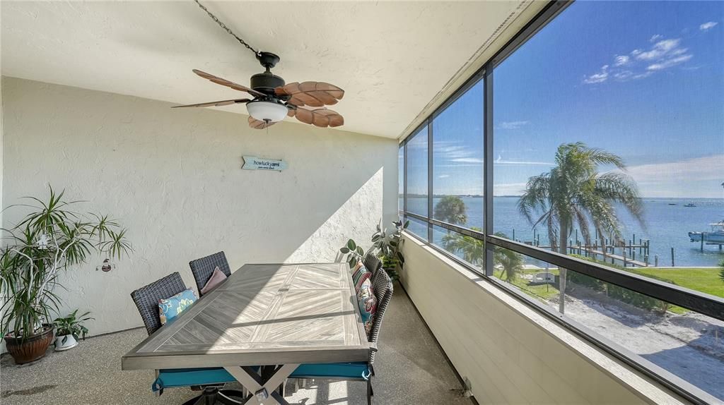 Screened in balcony with bay and gulf views