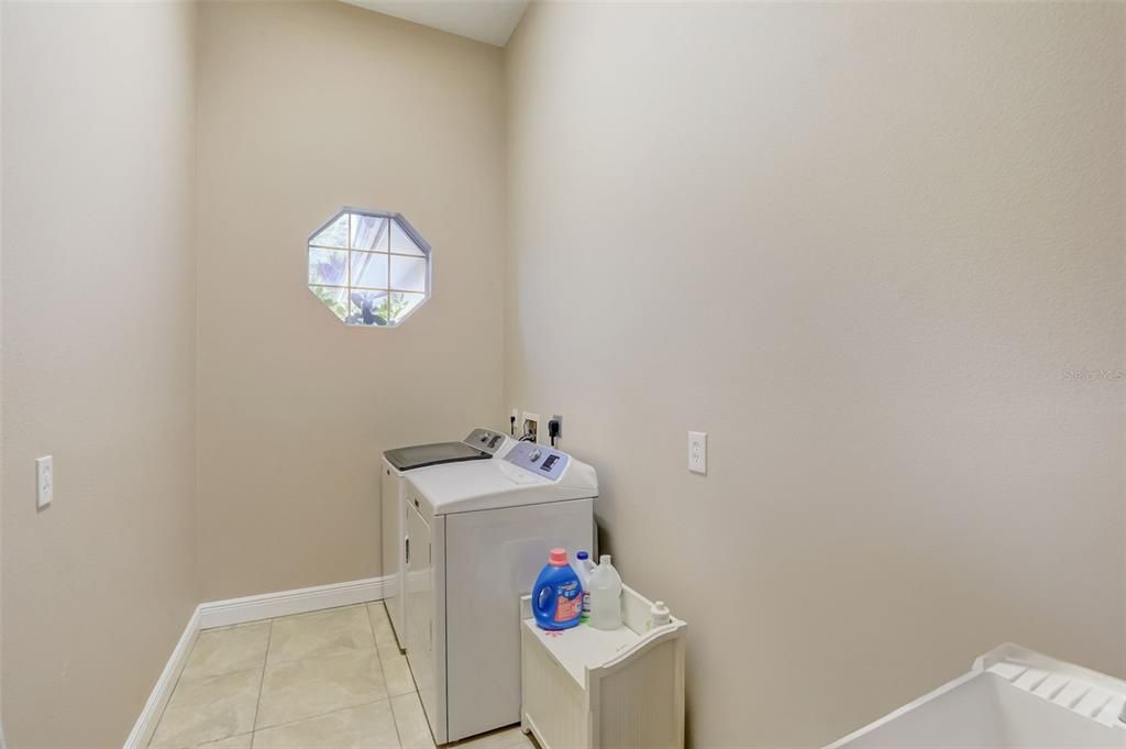 Oversized laundry room with laundry sink