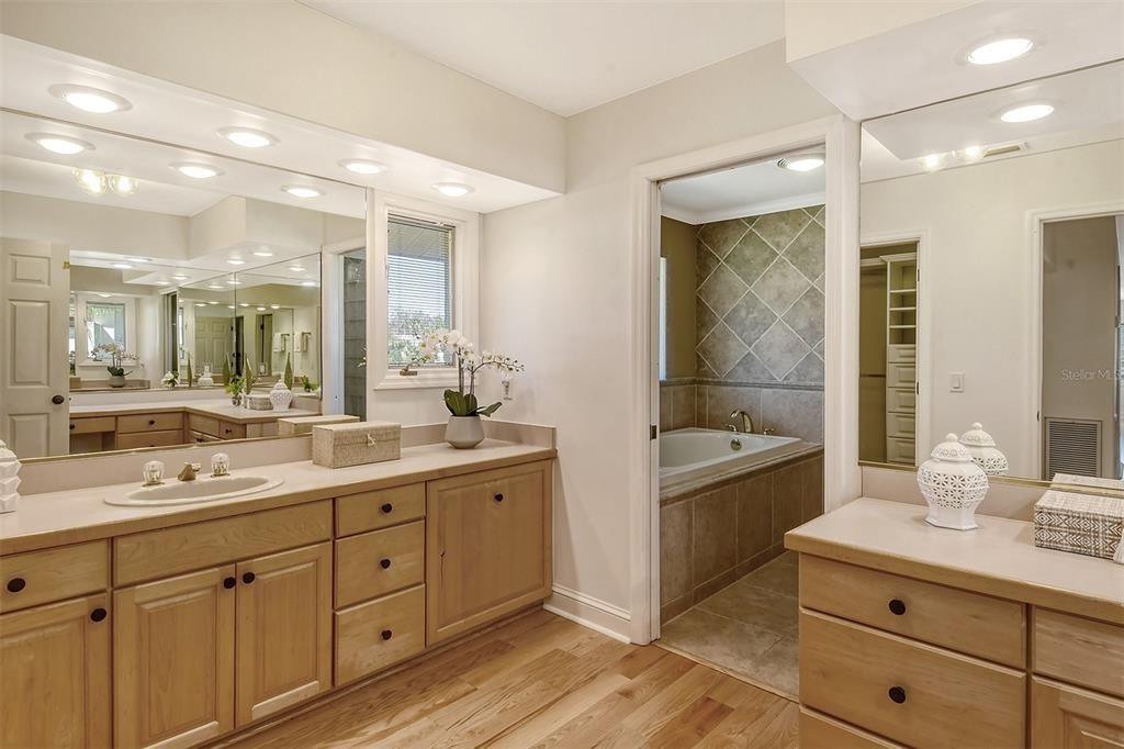 The primary bath has large garden tub and walk-in shower.