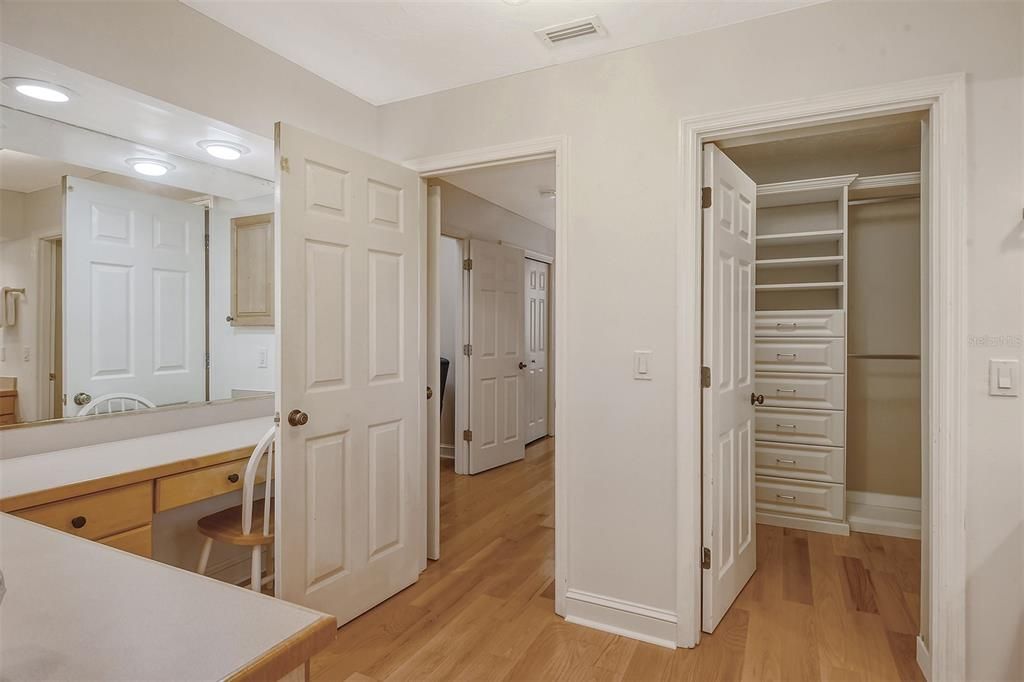 2 walk-in closets that have built-in shelving and drawers. Another hall closet close by.