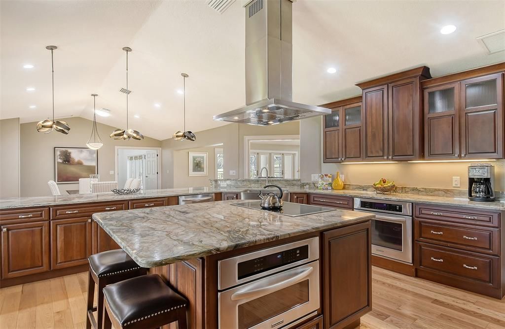 Stylish wood cabinetry, pot drawers, pull out drawers and pantry.