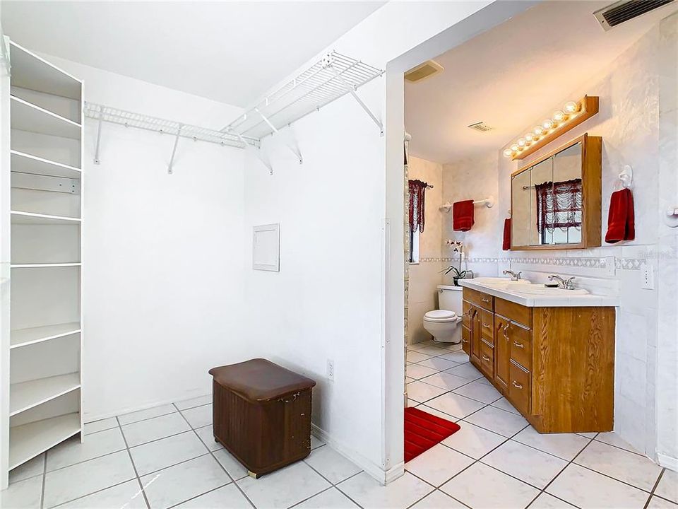 The walk-in master bedroom closet is shown on the left and the master bath on the right.