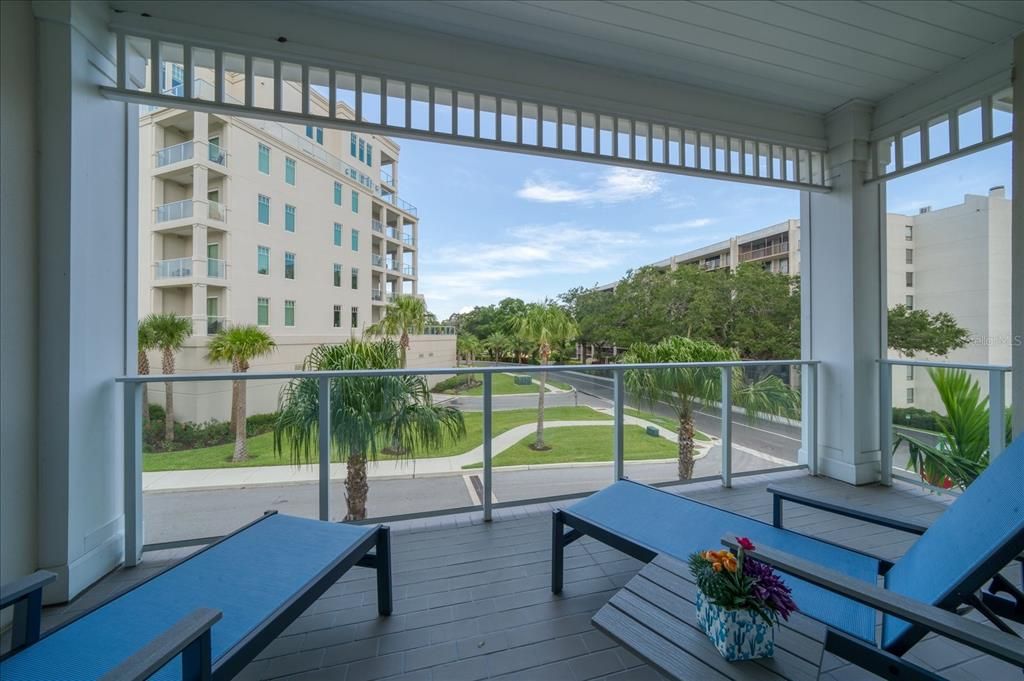 A private terrace off of the large guest bedroom is inviting! Preferred end location, one enjoys the lovely vistas and sunsets through the lovely tree lined street.