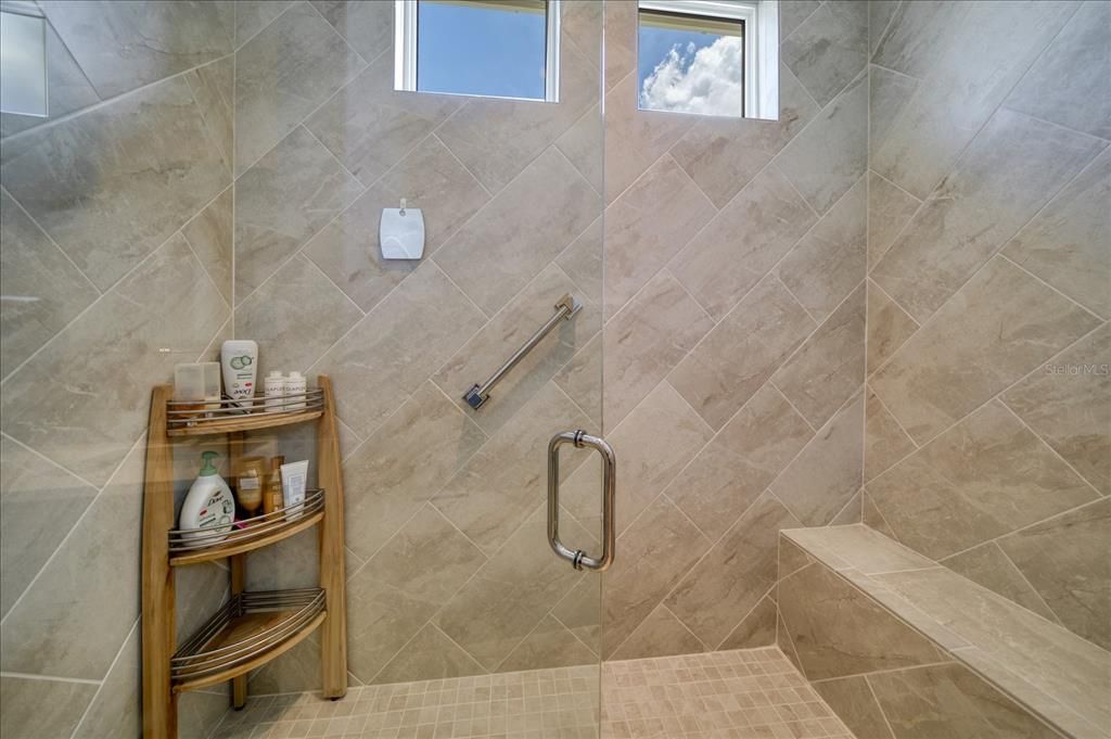 Walk in shower in Primary main level suite.