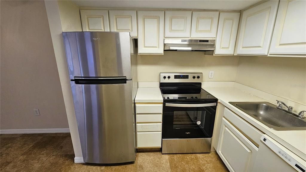 Brand new Stainless Steel refrigerator, glass top stove and matching vent hood are a nice update.