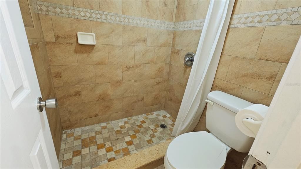 Tastefully decorated bathroom tile adds a touch of elegance.