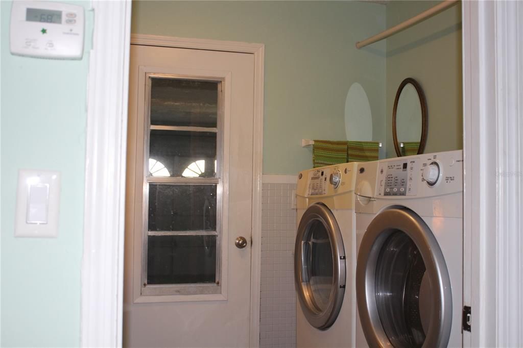 Laundry room off kitchen & door out to the garage