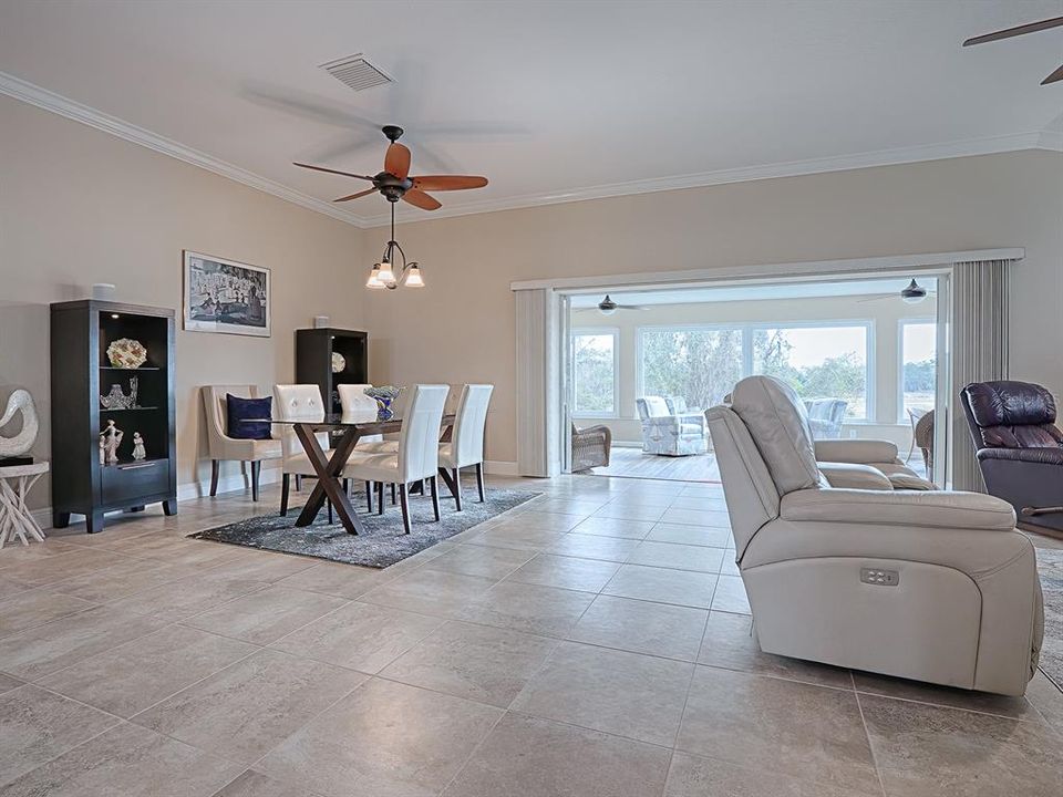 LOVELY TILE FLOORING. CROWN MOLDING WHICH RUNS THROUGHOUT THE HOME.