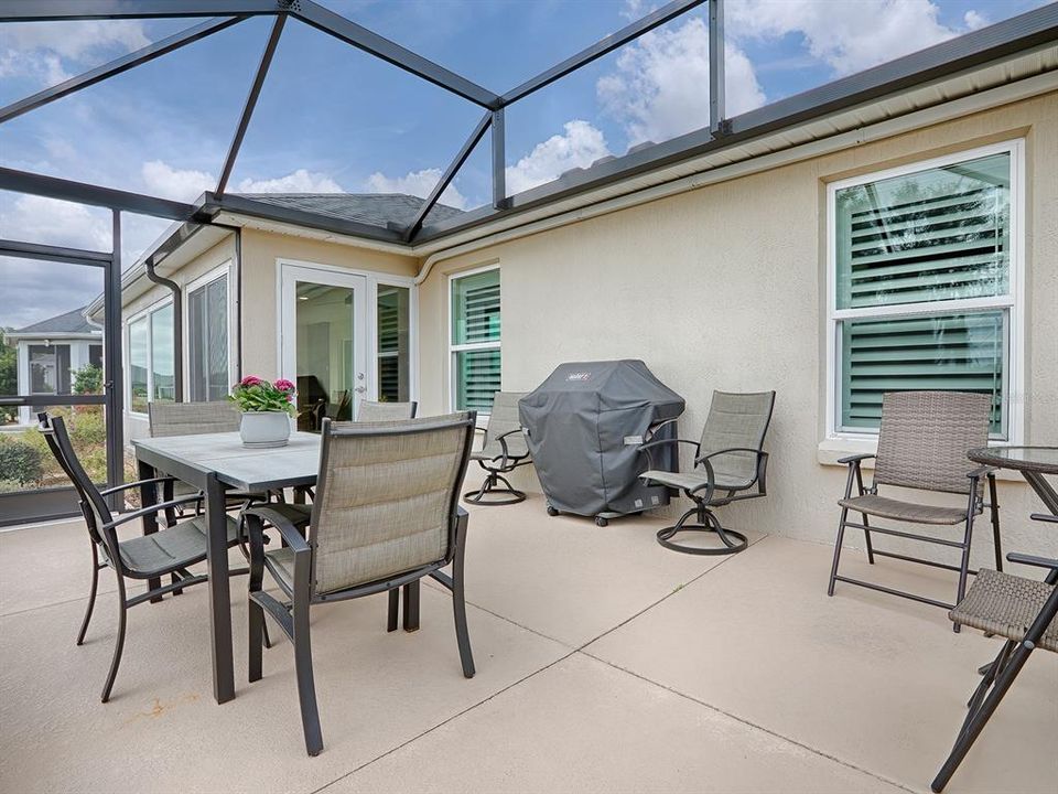 BIRDCAGE WITH PAINTED FLOORING, A GREAT PLACE TO GRILL AND ENJOY THE FLORIDA SUNSHINE.