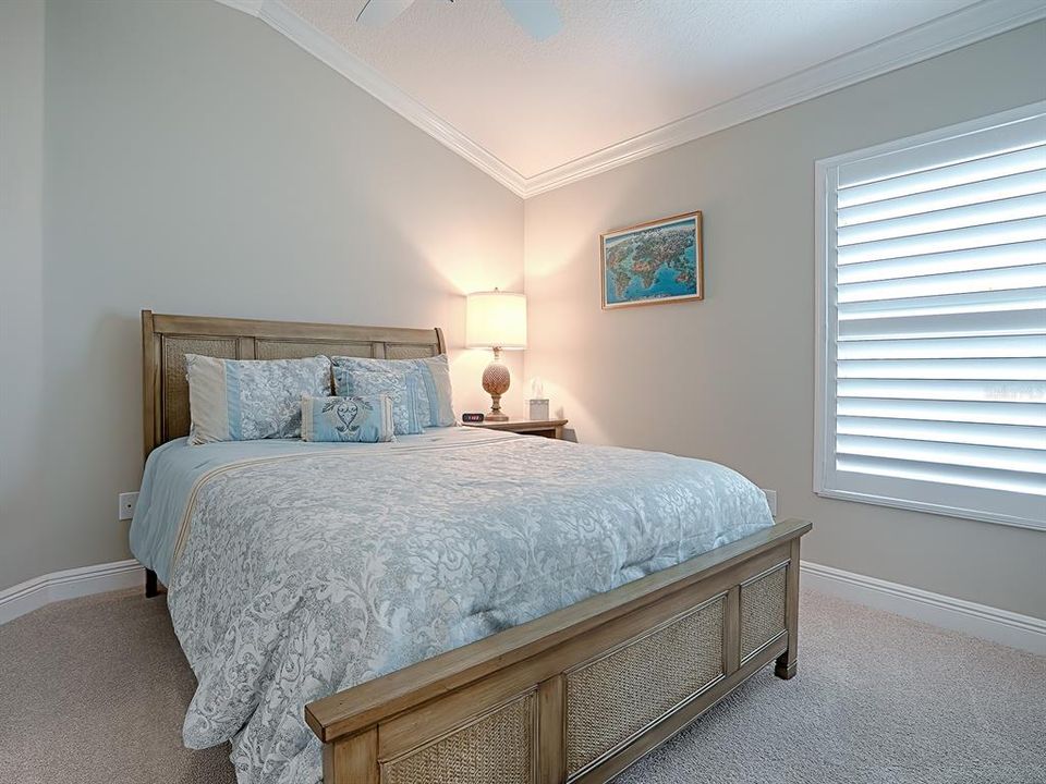 2ND GUEST BEDROOM ALSO WITH VAULTED CEILINGS, AND PLANTATION SHUTTERS.