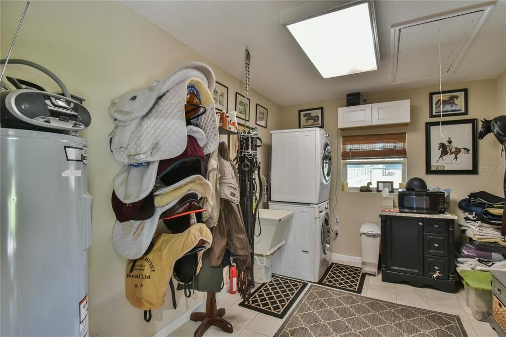 tack room with laundry and laundry tub