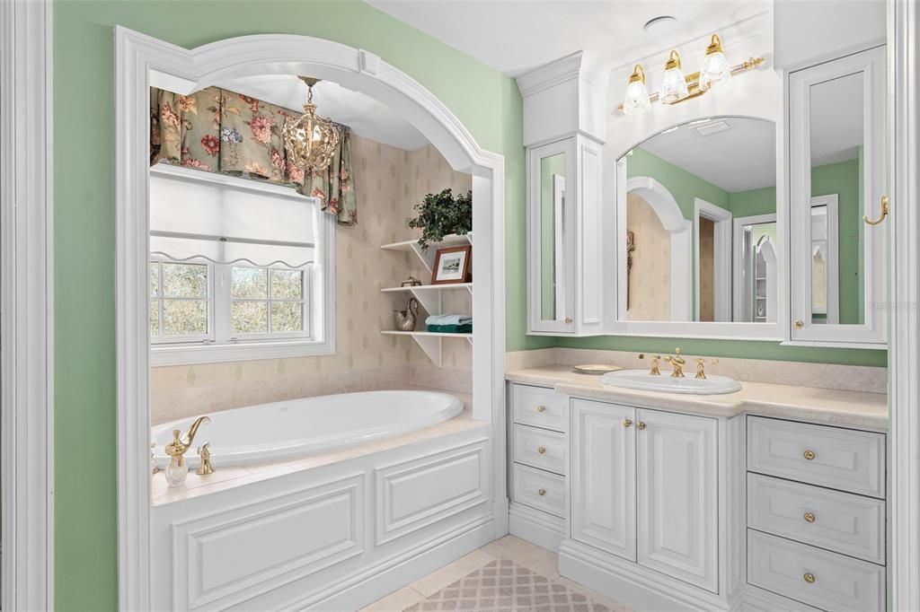 Double vanities with marble counters, custom cabinetry & millwork
