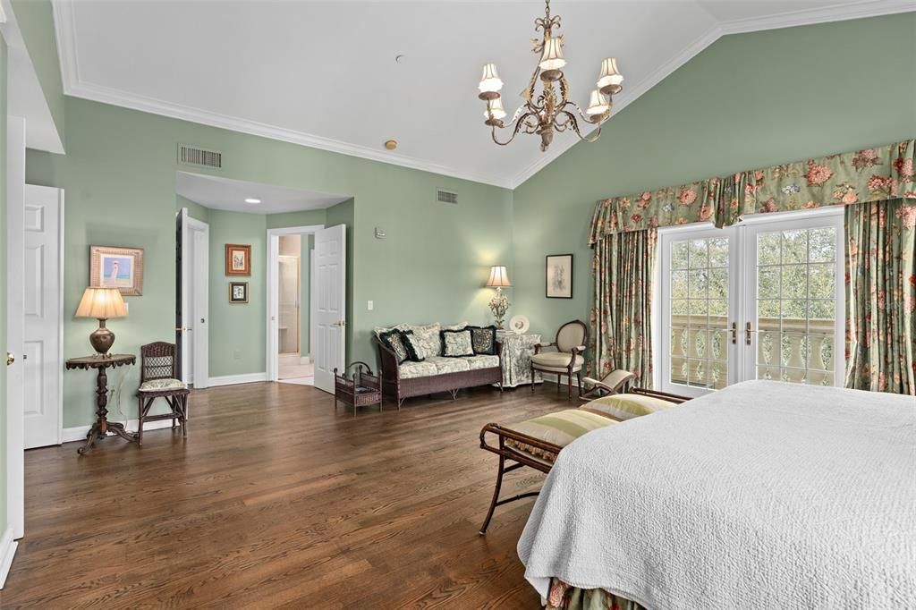 Primary suite with Oak wood floors & crown molding