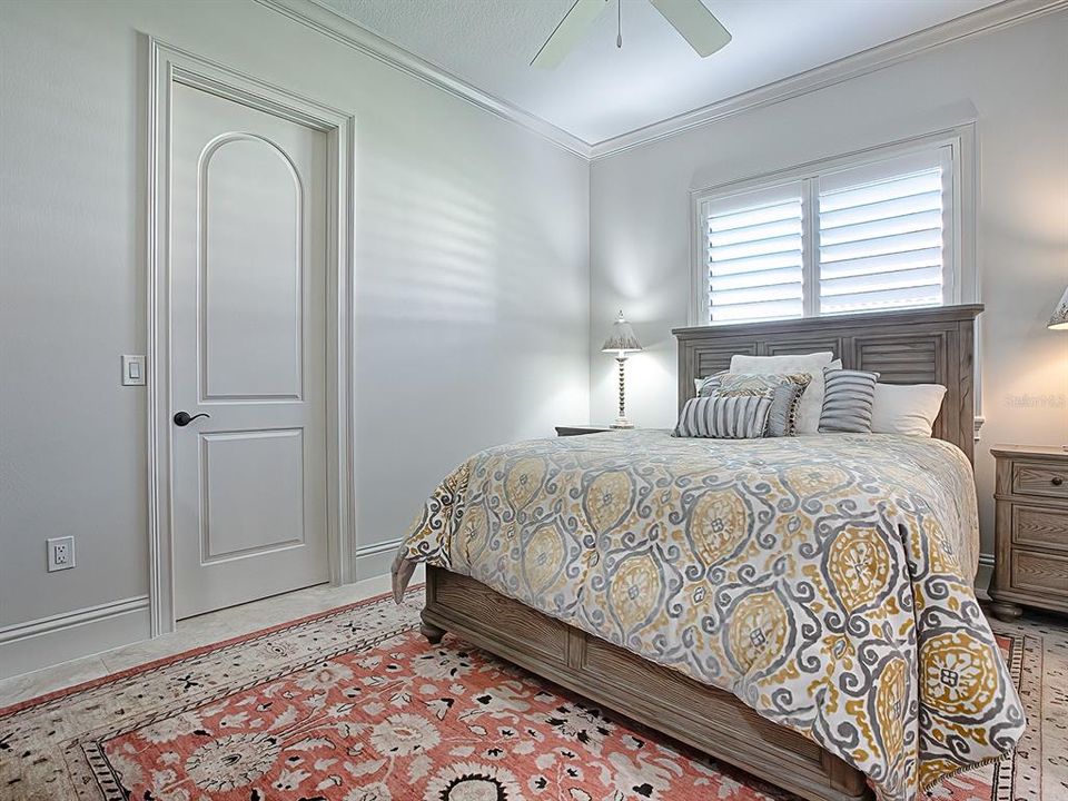 Bedroom #2 offers a walk-in closet with all new custom closet organizer system.