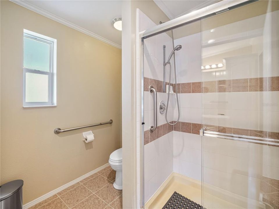 Ensuite bathroom has a large shower stall.