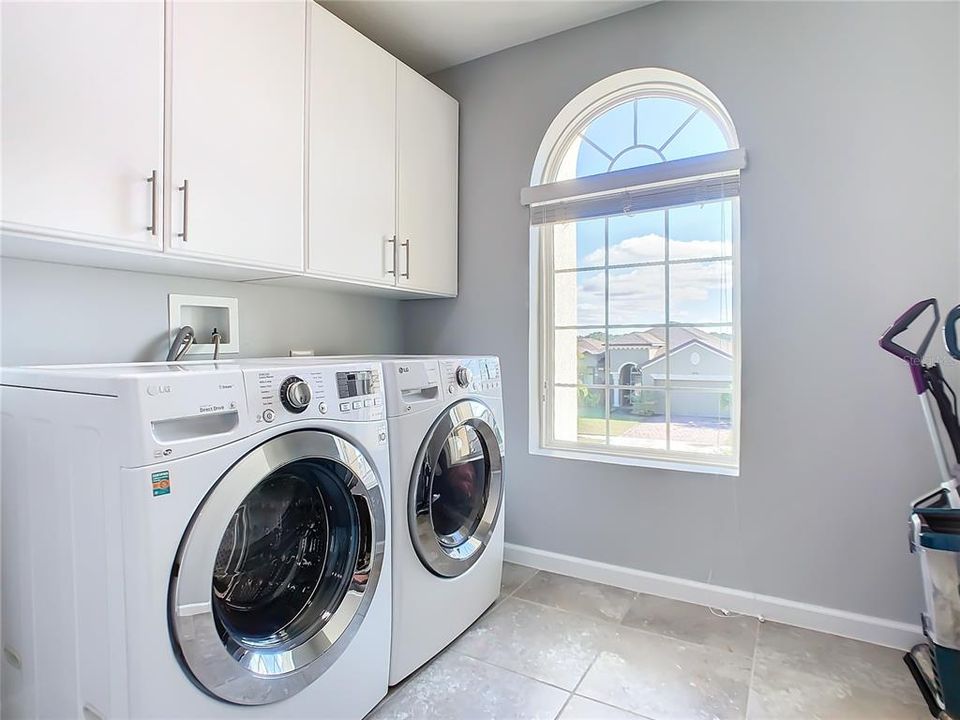 2nd Floor Laundry complete with custom cabinets