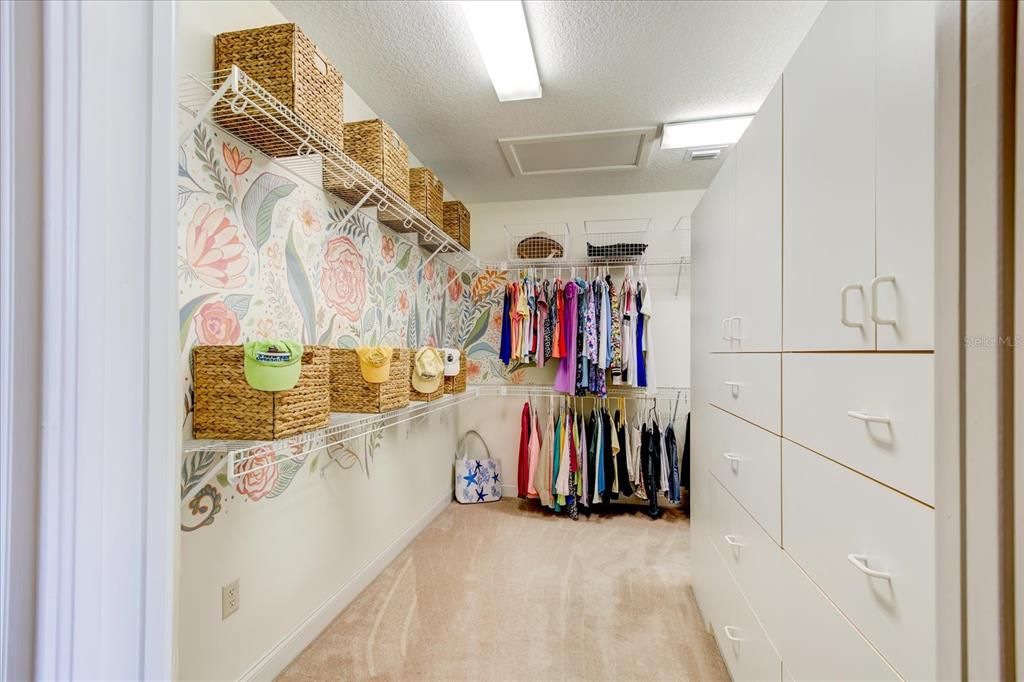 Walkin 11' by 11' closet with lots of storage.  Continues around the corner.