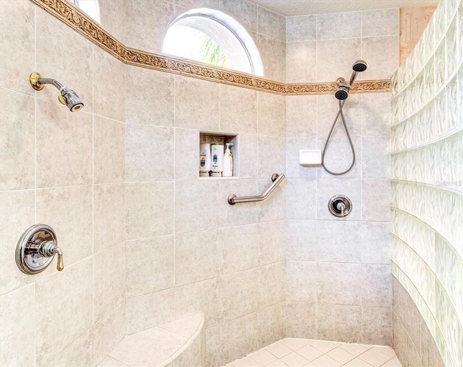 Awesome double shower with seating area.
