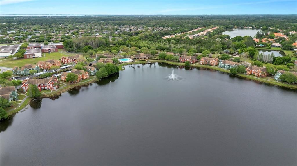 Lake in the center of community with walking trail.