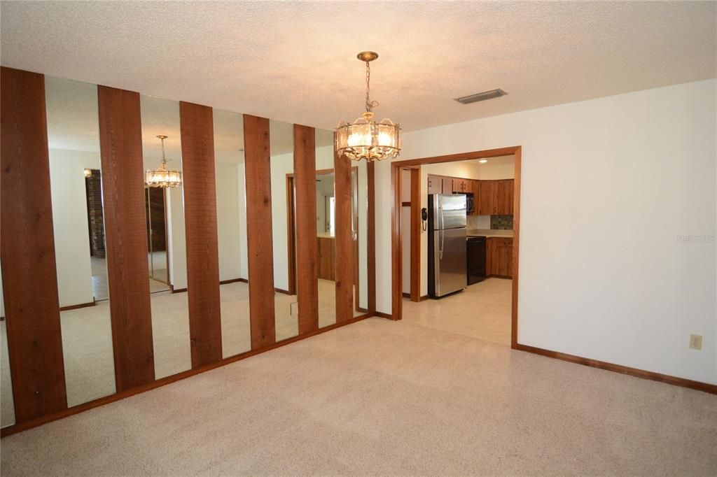 Formal and spacious dining room off of the kitchen