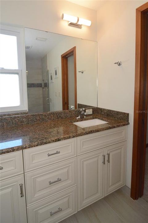 Full bath with an updated vanity