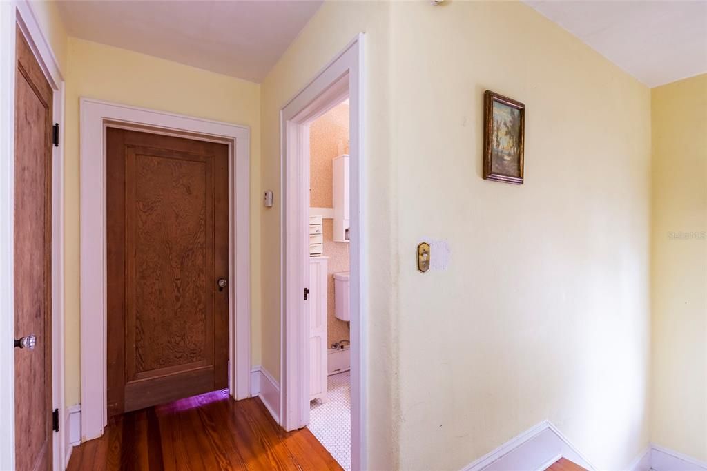 Upstairs hall with linen closet across from the full bathroom.
