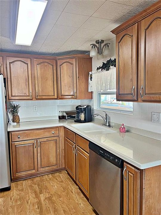 Custom kitchen wood cabinets, stainless steel appliances