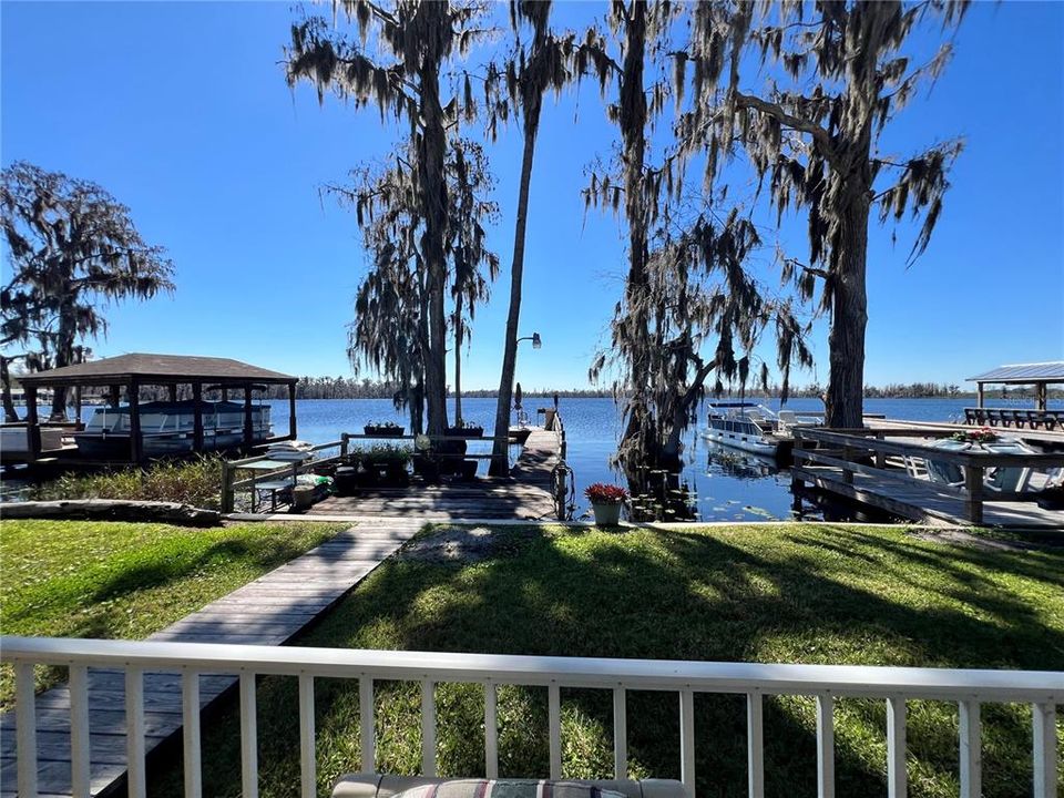 Waterfront lot on the Clermont Chain of lakes. private boat slip and concrete retaining wall.
