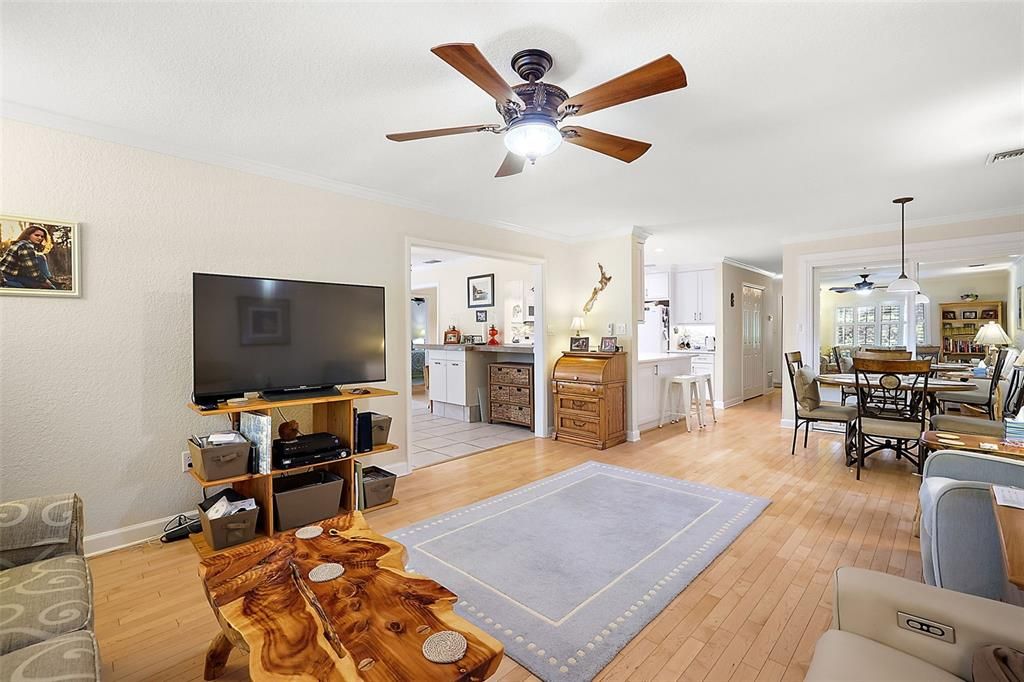 The family room has views of the kitchen, dinette and Florida room