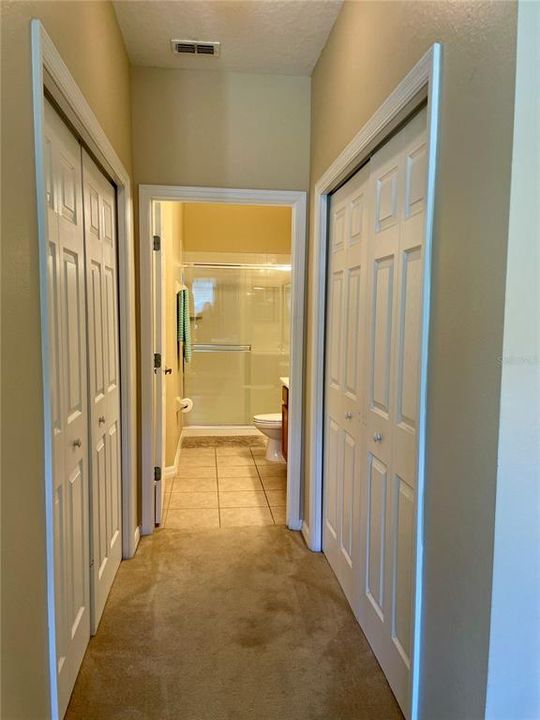 Hallway to bedroom 2, 3 2nd bathroom and garage