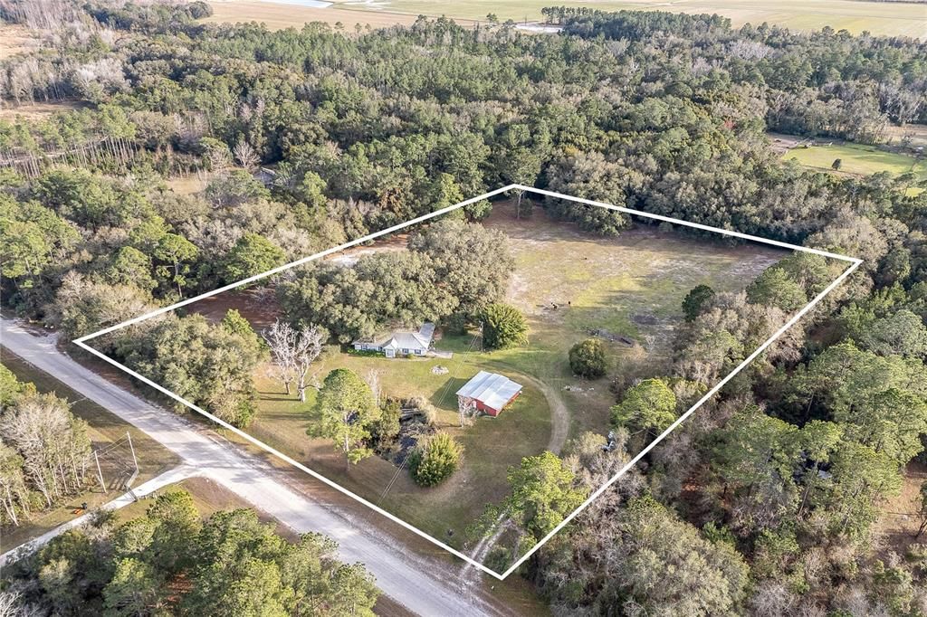 Aerial view of home and 7.5 acres of land
