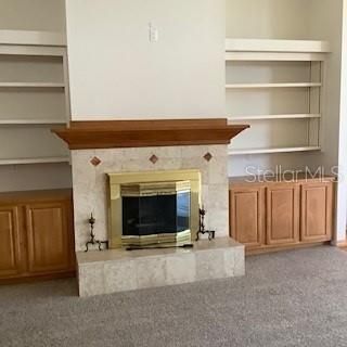 Fireplace with built in shelving