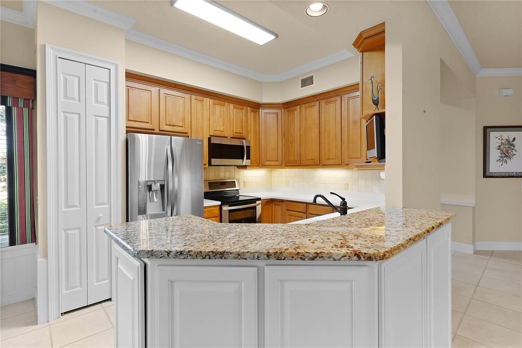 Kitchen with granite and solid surface countertops