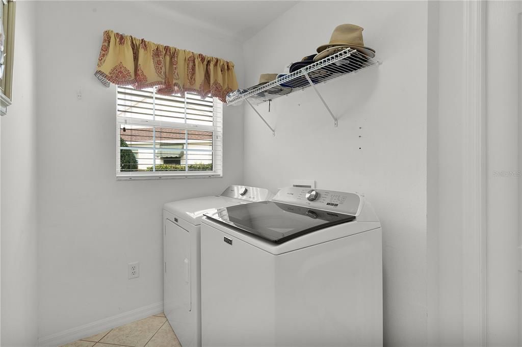 INSIDE LAUNDRY WITH UPGRADED APPLIANCES
