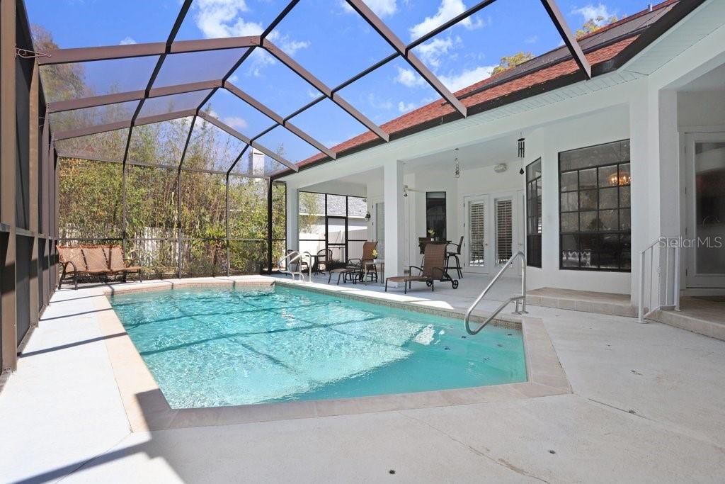 The oversized pool is screened-in and so inviting!