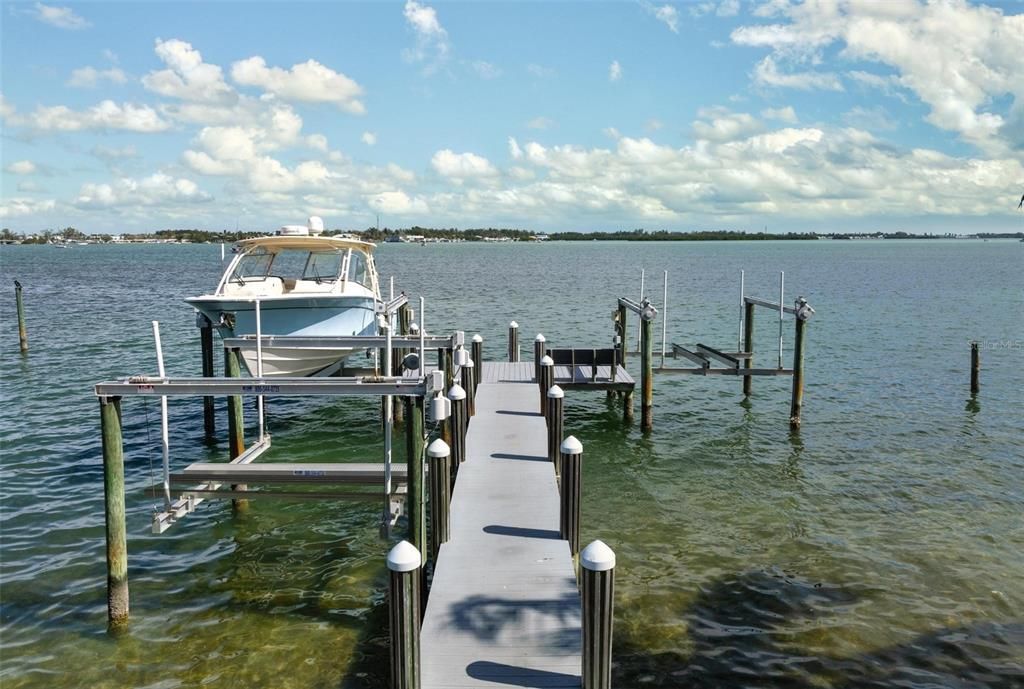 Dock with two boat lifts and a jet ski lift