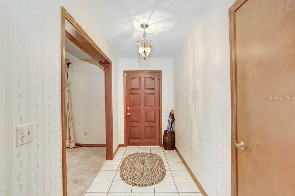 As you enter, you're greeted by a large living area to your right.