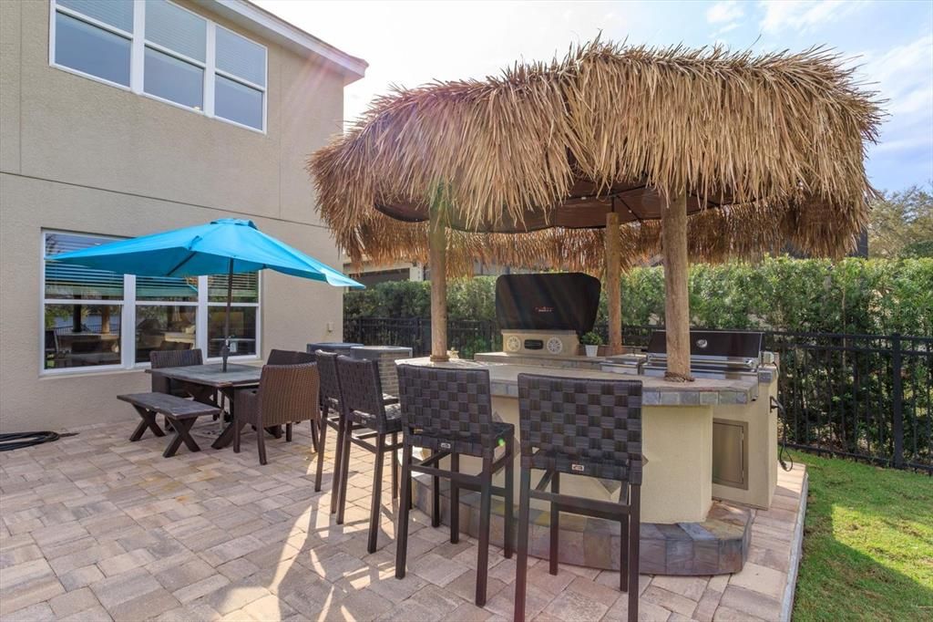 Tiki bar with grill and television