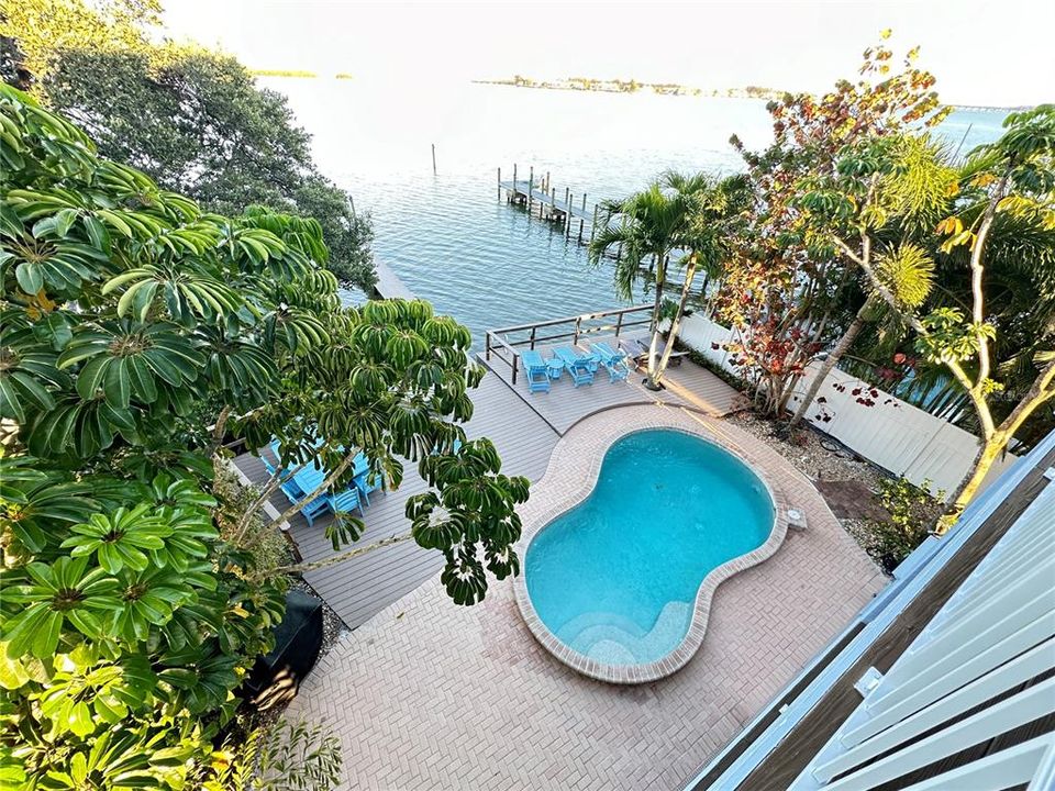 3rd floor balcony view of pool area and Sarasota Bay