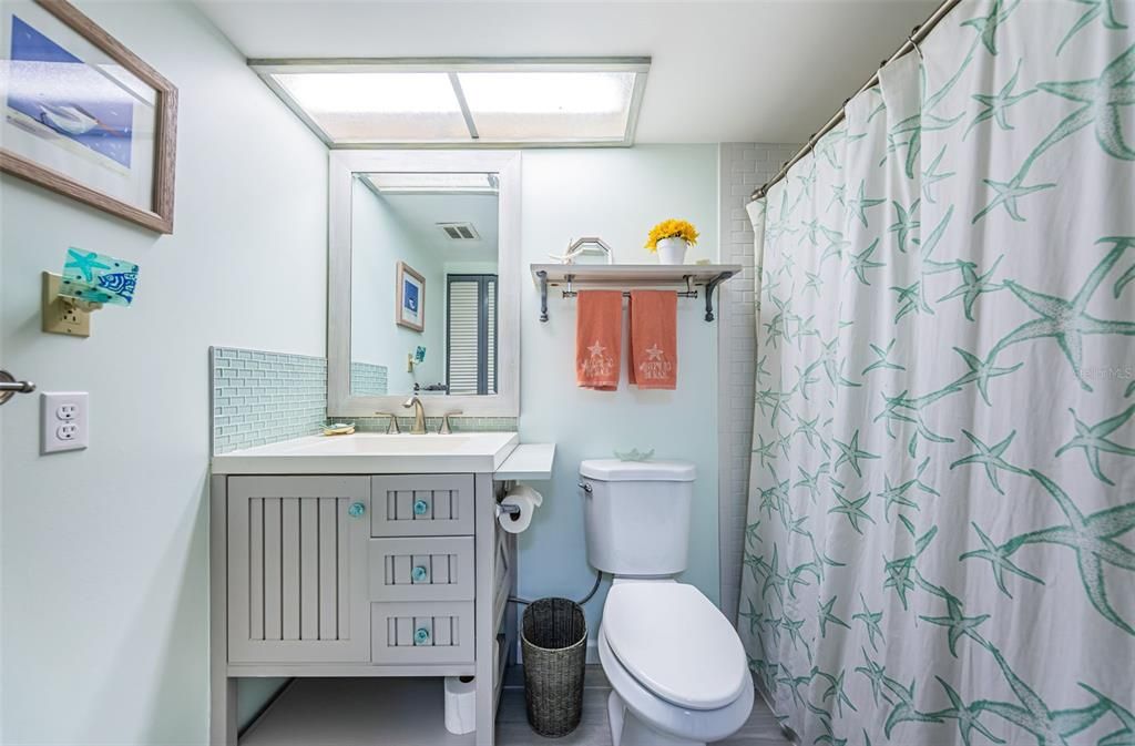 Bathroom with updated vanity and toilet