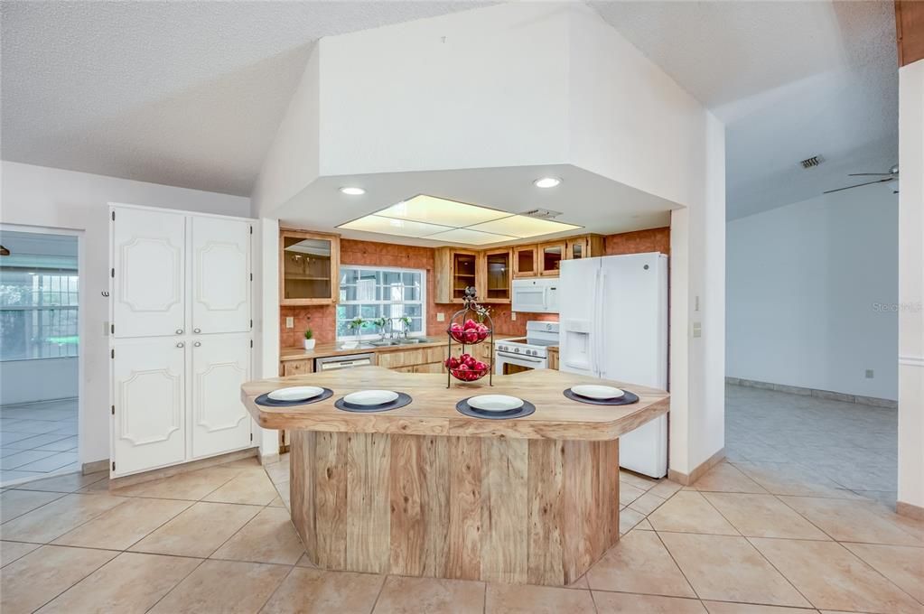 Open Concept Kitchen with large island and storage pantry