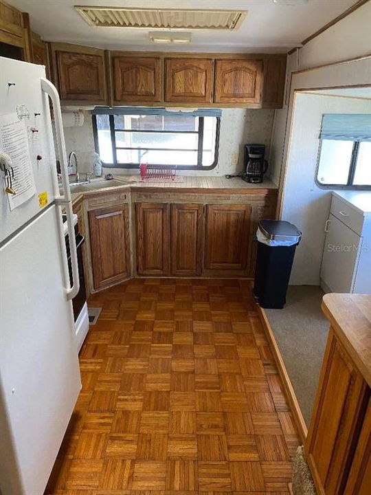 Kitchen has parquet flooring