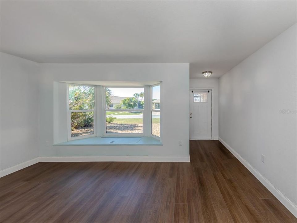 Fresh and lovely new flooring flows through the main areas of the home, including the bedrooms.