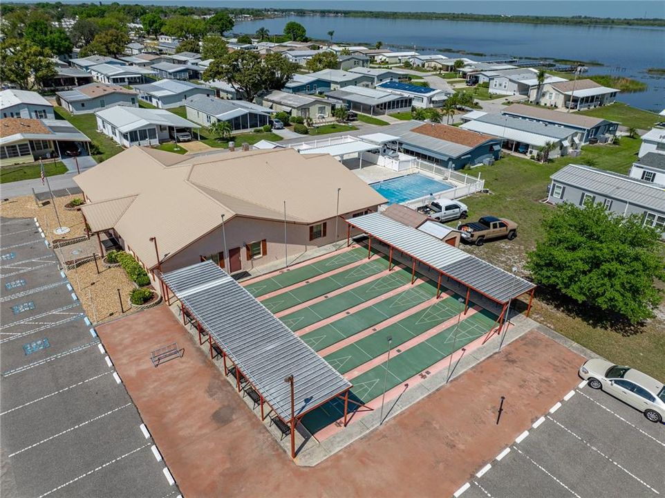 AERIAL VIEW OF CLUBHOUSE, POOL, SHUFFLEBOARD