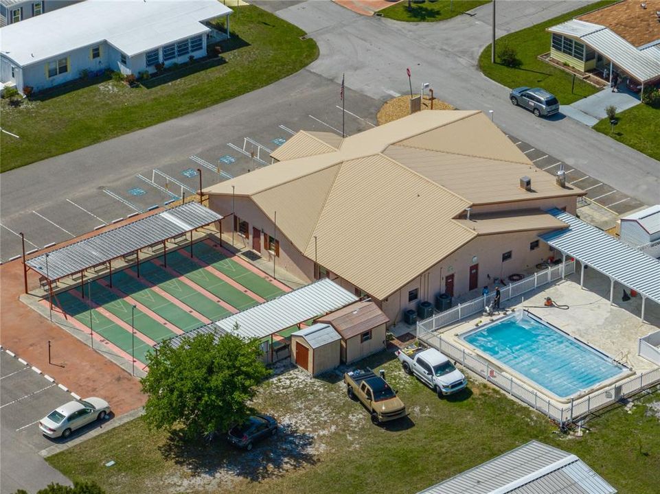 AERIAL VIEW OF CLUBHOUSE, POOL, SHUFFLEBOARD