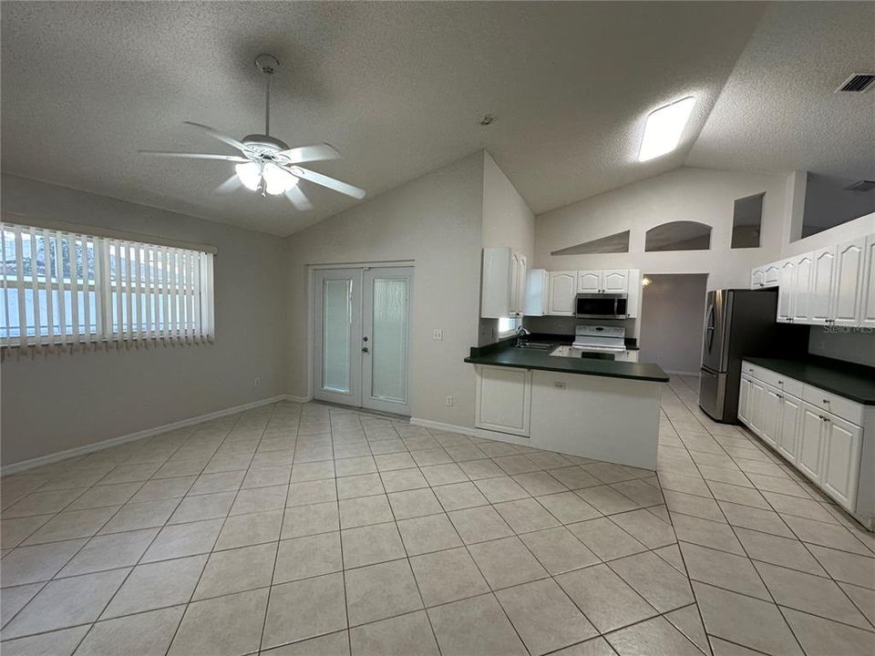 Back Living Area, Kitchen and Patio Doors leading to Back Patio