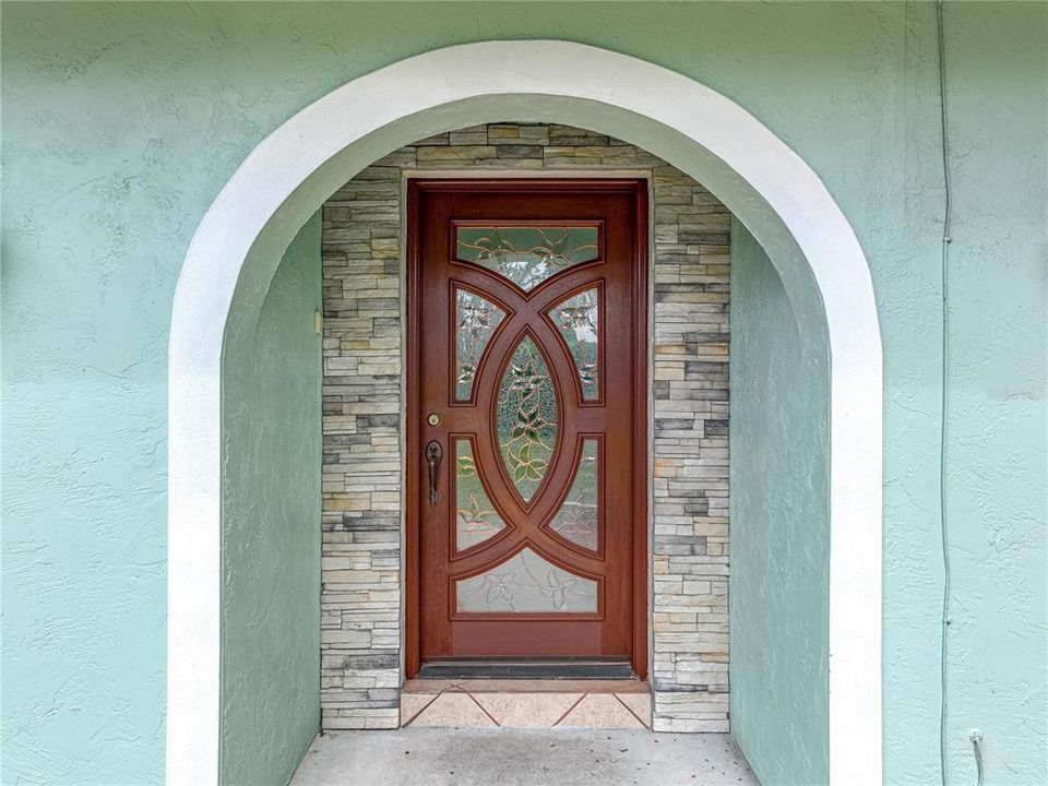 Copper and glass front door is beautiful.