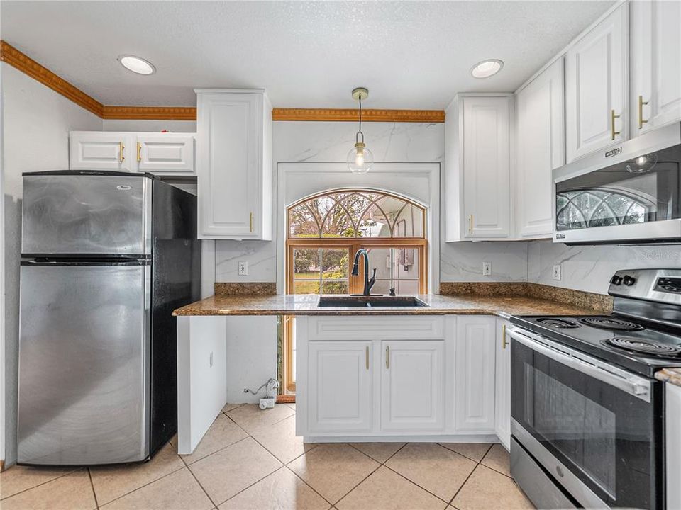 Space for dishwasher is by the refrigerator.