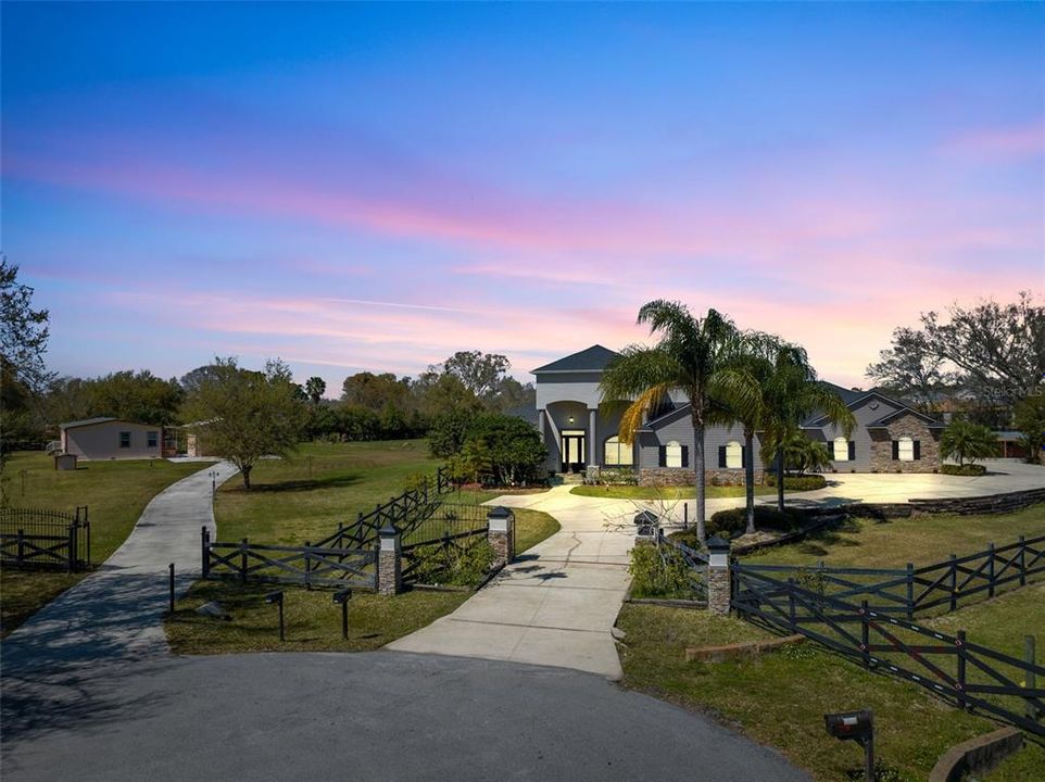 Welcome to an unparalleled living experience where luxury meets functionality in this magnificent custom home, nestled on a sprawling 2.5-acre gated property.